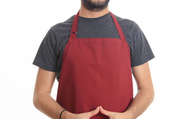Young man with red apron - Photo, Image