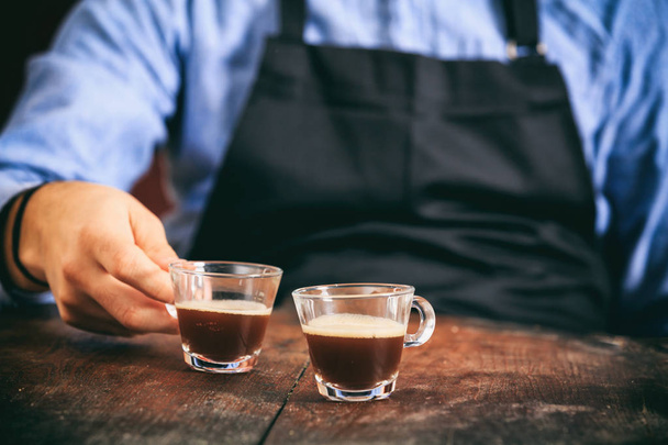 Barista and two espresso cups - Photo, Image