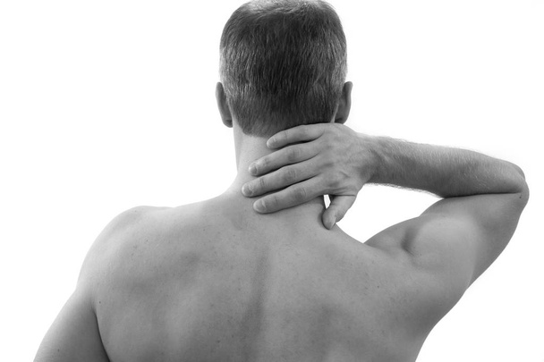 Боль в шее. Человек с болью в спине. Мускулистое мужское тело. Изолированная на белом фоне красная точка
 - Фото, изображение