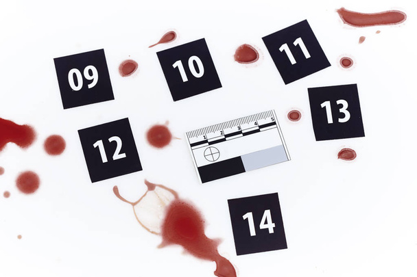 Larger evidence of blood drops on white background - Foto, afbeelding