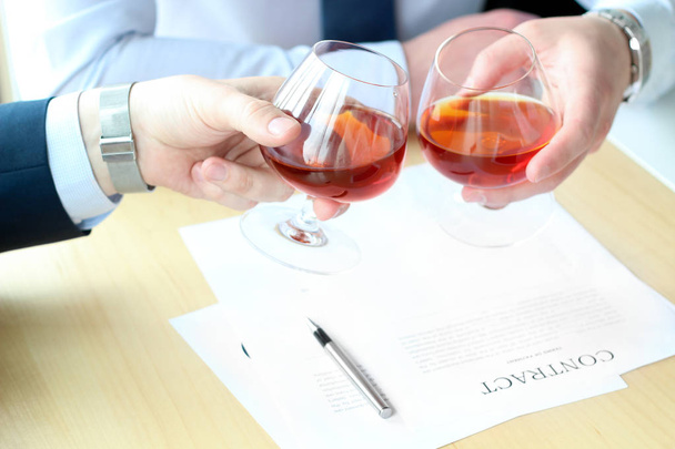Two colleagues celebrate signing a contract with Whisky - Foto, Imagem