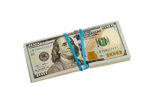 Kätkössä sadan dollarin seteleitä kuminauhalla eristetty
 - Valokuva, kuva