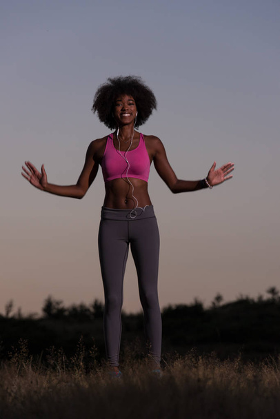 black woman is doing stretching exercise relaxing and warm up - Foto, Imagen