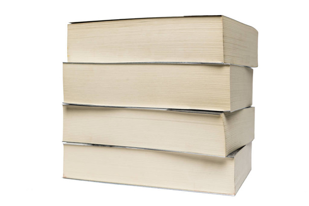 Empilement de vieux livres de poche isolés sur fond blanc
 - Photo, image