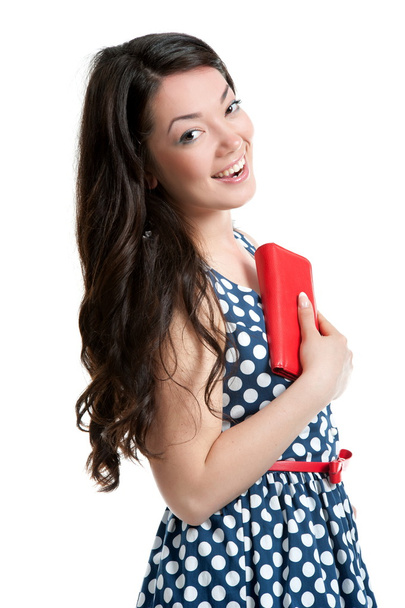 Beautiful young woman in polka dot dress - Фото, изображение