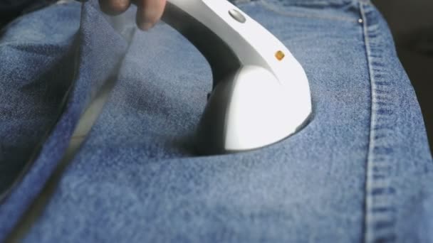 Process of steaming of jeans fabric using steamer - Πλάνα, βίντεο