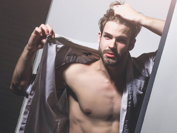 Handsome man shows muscle torso - Valokuva, kuva