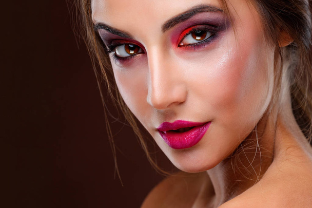 Portrait of sexual beautiful girl with  bright fashion makeup  on a  dark  background - Фото, зображення