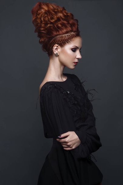 Beautiful girl in evening dress with avant-garde hairstyles. Beauty the face. - Фото, зображення