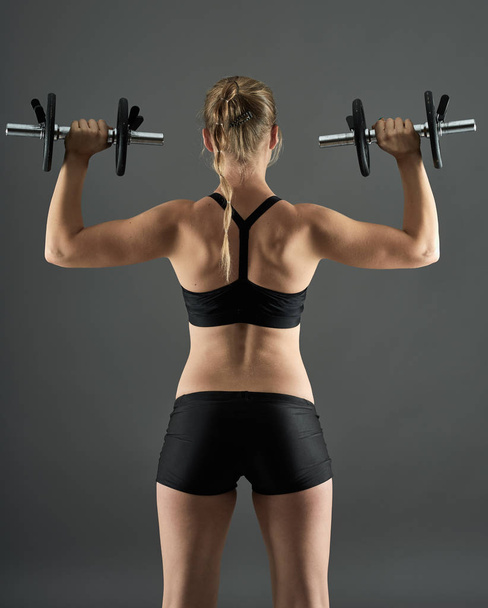 fit woman with dumbbells - 写真・画像