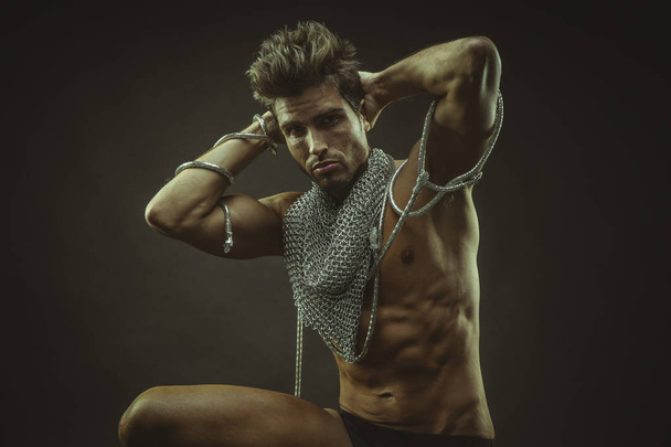 Elegant and muscular man with naked torso and chains  - Fotoğraf, Görsel