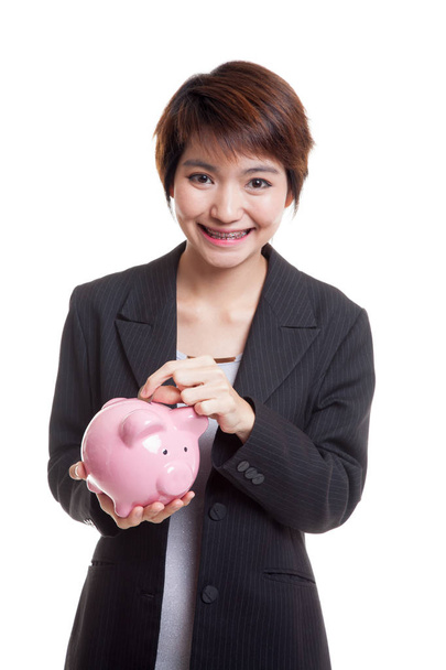 Asian business woman with coin and pig coin bank. - Fotó, kép