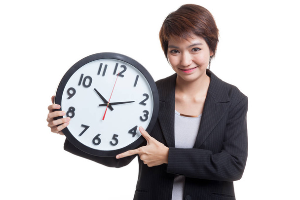 Young Asian business woman with a clock. - Foto, immagini