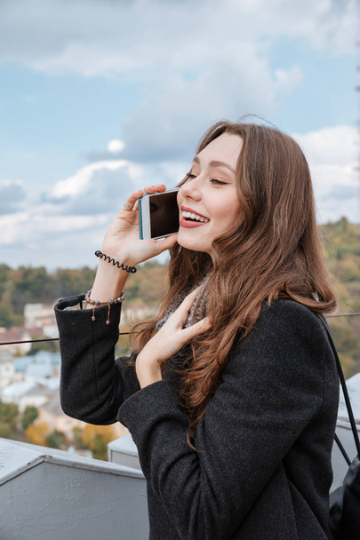 Young model talking at phone - Fotoğraf, Görsel