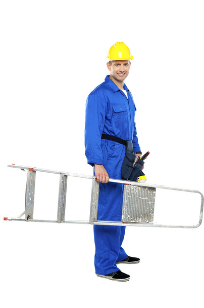 Young repairman ready with stepladder - Photo, image