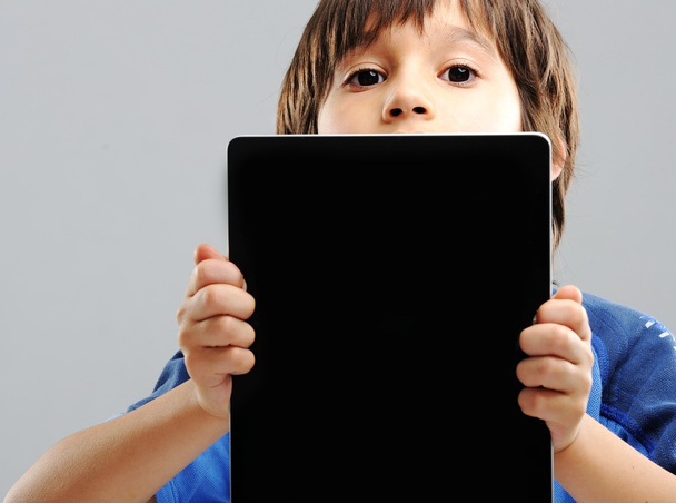 Cute little boy with Tablet PC - Фото, зображення