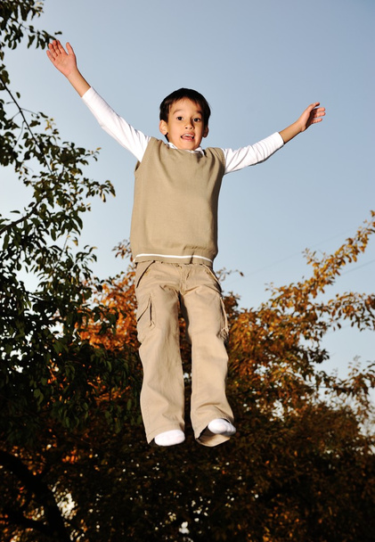 Kid jumping very high - 写真・画像
