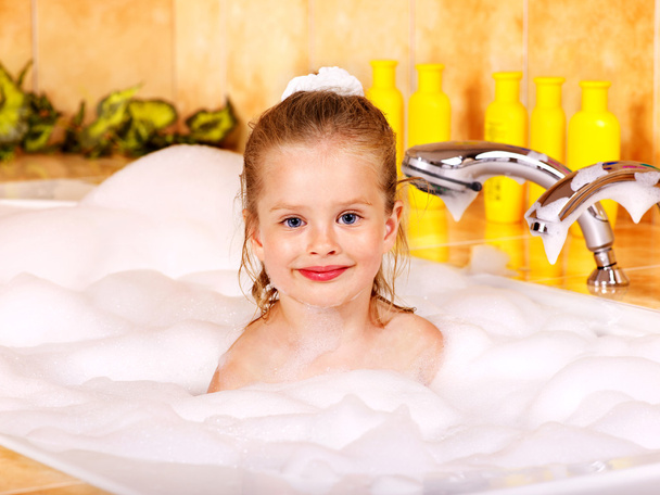 Child washing in bubble bath . - Photo, Image