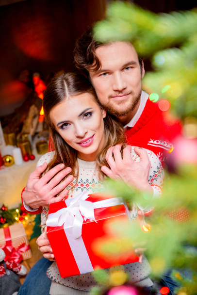 Happy couple with christmas present   - Fotografie, Obrázek