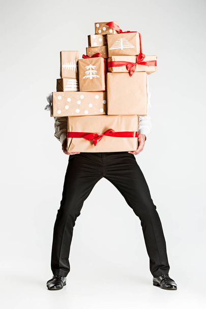 Gift boxes in the hands of young man - Foto, afbeelding