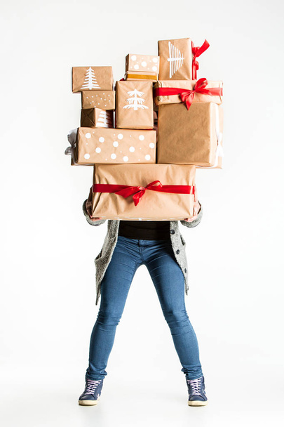 Gift boxes in the hands of young woman - Фото, изображение