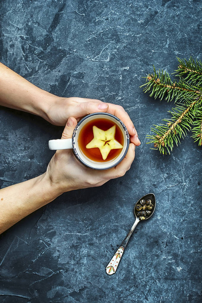 Cup with tea in hand - Фото, зображення