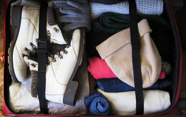 packed up suitcase to go to the winter trip - 写真・画像