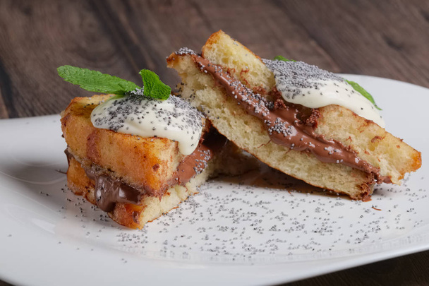 brioche with chocolate cream, sweet cheese and mint - Fotó, kép