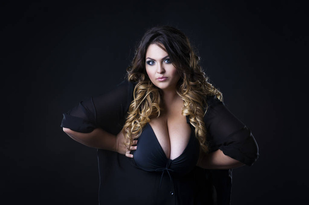 Young beautiful plus size model in underwear, xxl woman on black background - Fotoğraf, Görsel
