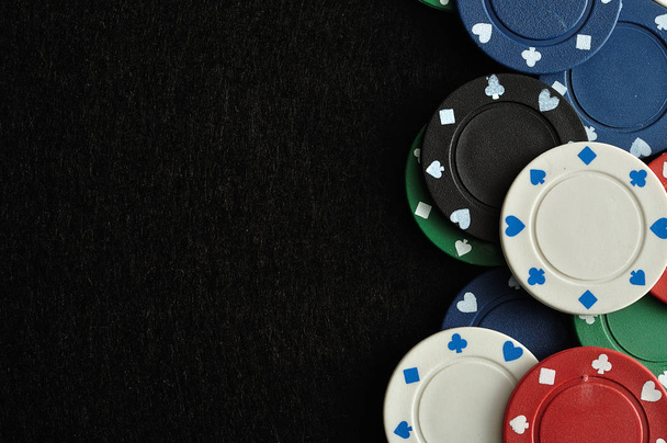 Poker chips forming a border with a black background - Photo, Image