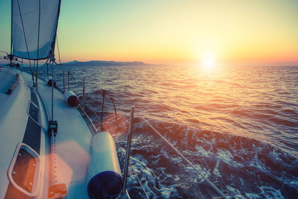 Sailing yacht at sunset  - Photo, Image
