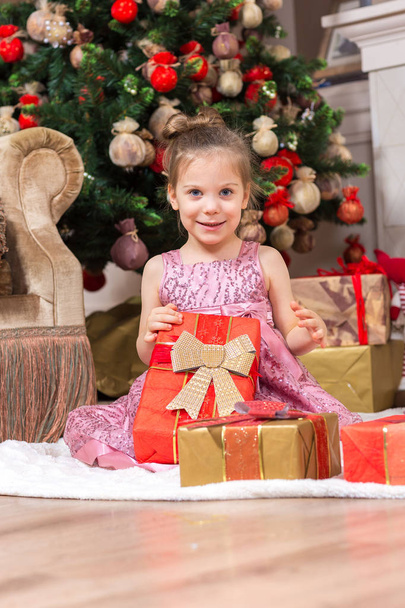 Little girl with Christmas present - Fotó, kép