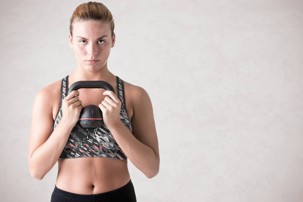 Woman Working Out With a Kettlebell - Photo, Image