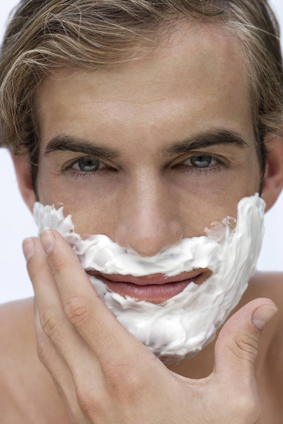 young man with shaving cream - Foto, Bild
