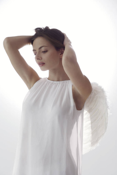 woman wearing angel wings - Fotó, kép