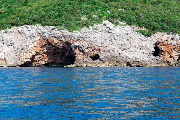 Sea cave with blue water at daytime - Fotoğraf, Görsel