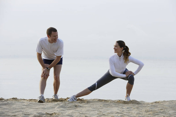 couple stretching before run  - Foto, imagen