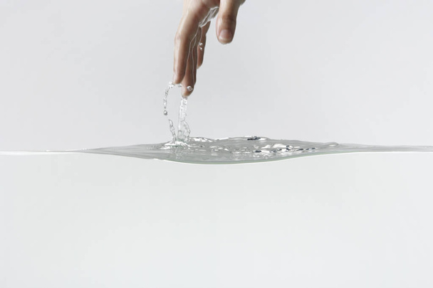 hand pulling up and out of water  - Photo, image
