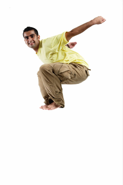 Young man jumping in mid-air - Zdjęcie, obraz