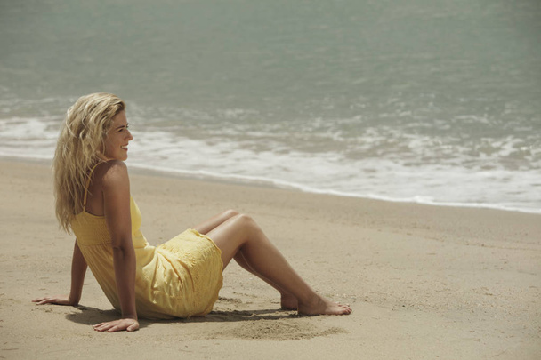 woman sitting on beach - Photo, Image