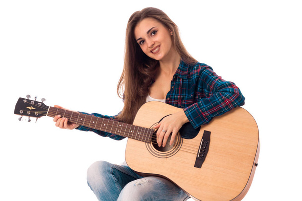 charming lady with guitar in hands - Фото, зображення