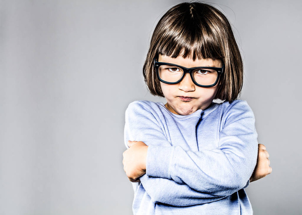 kid body language with sulking, pouting small child crossing arms - Photo, image
