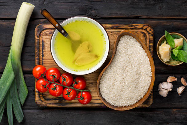 Ingredients for risotto with tomatoes and basil on cutting board - Fotografie, Obrázek