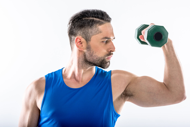 Man exercising with dumbbell - Photo, Image