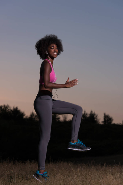black woman is doing stretching exercise relaxing and warm up - Foto, imagen