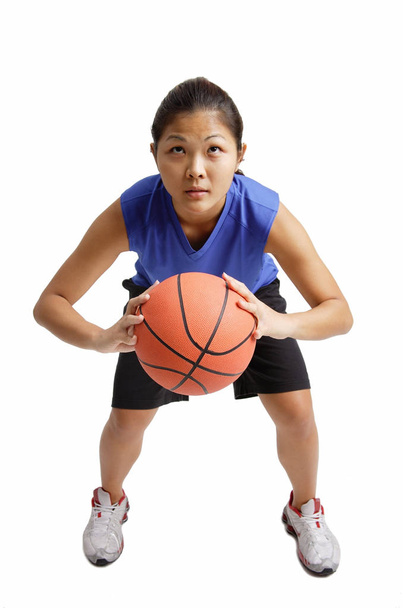  woman holding basketball - Foto, Imagen