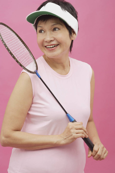  woman holding badminton racket - Photo, Image