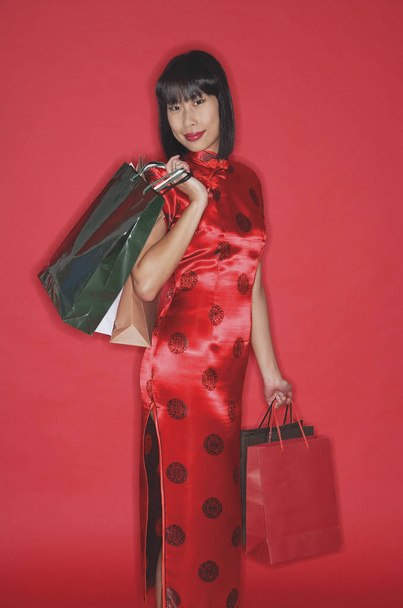 Woman in red cheongsam - Foto, Imagen