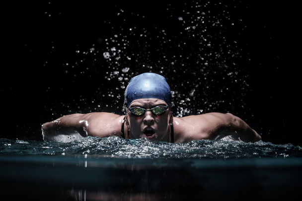 Profesional woman swimmer swim using breaststroke technique  - Photo, Image