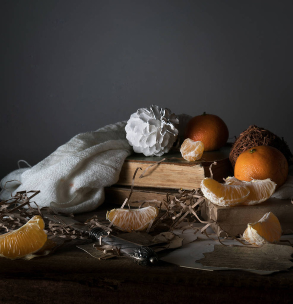 Healthy breakfast - Chia Seed Pudding with kumquats and granolastill life, vintage. tangerines, tangerine slices, white marshmallow, scarf  old silver knife on a wooden table. - Photo, Image